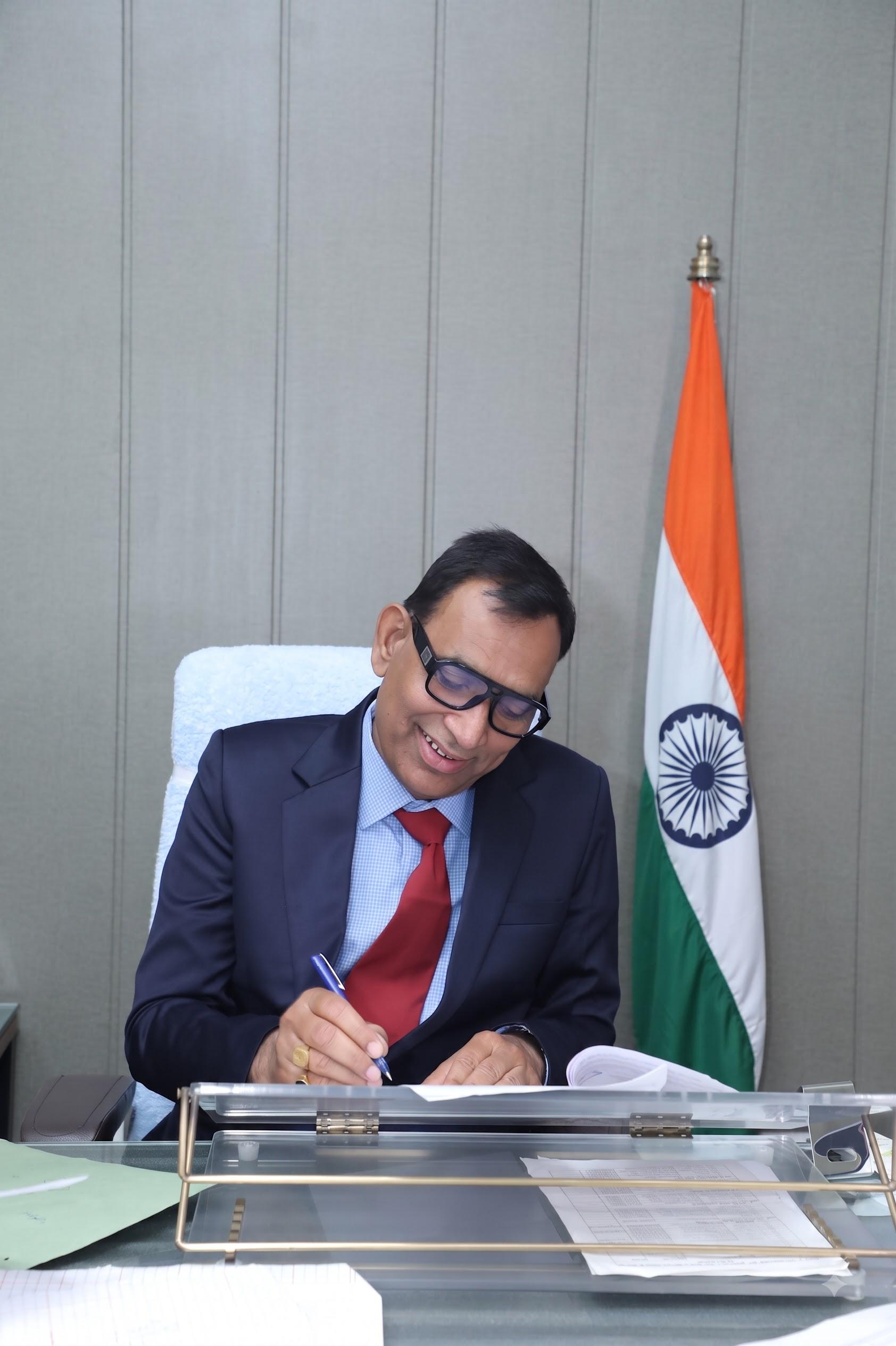 Er. Dhoop Singh reviewing engineering plans